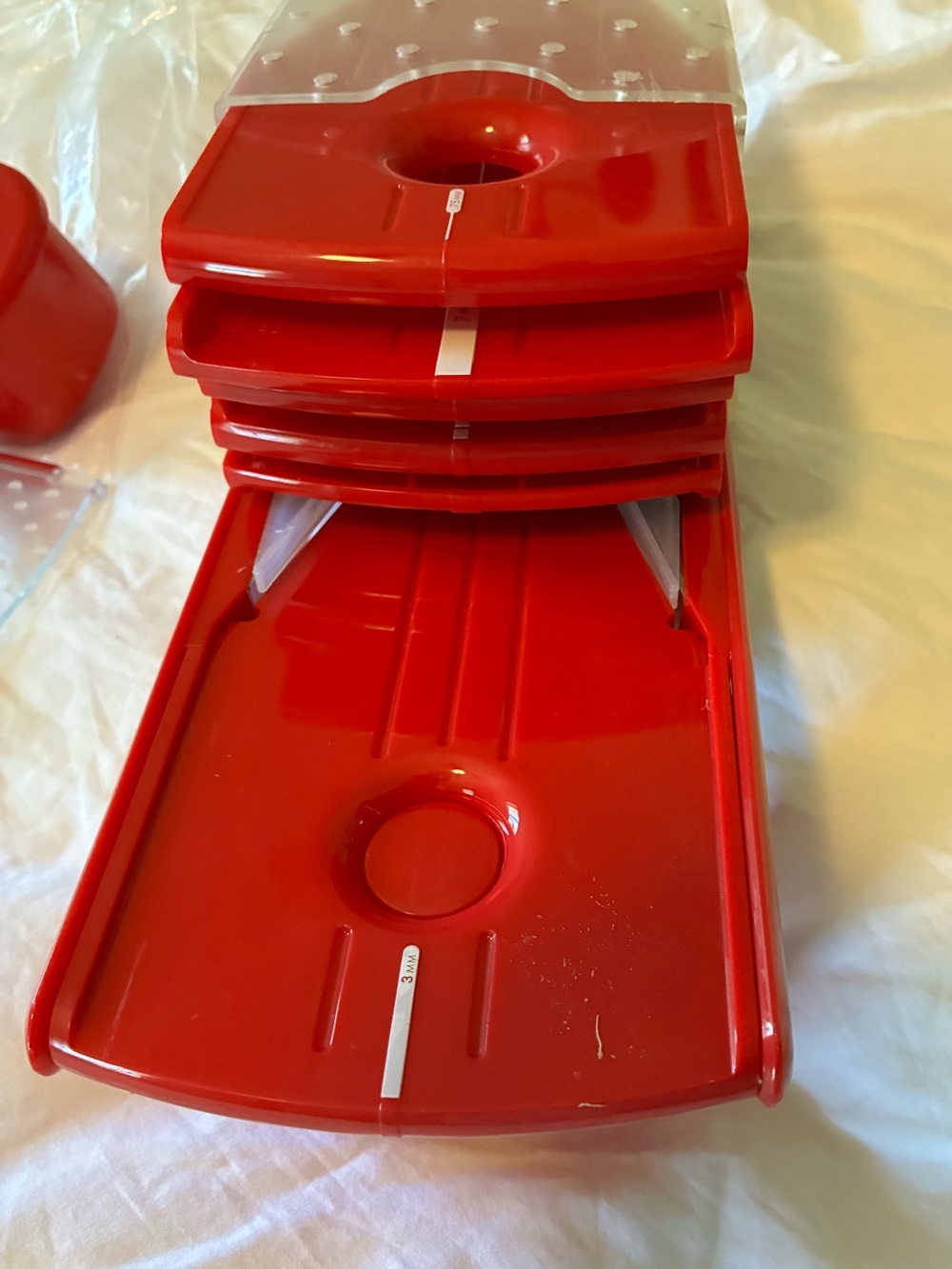 Red Stackable multi-piece mandoline.